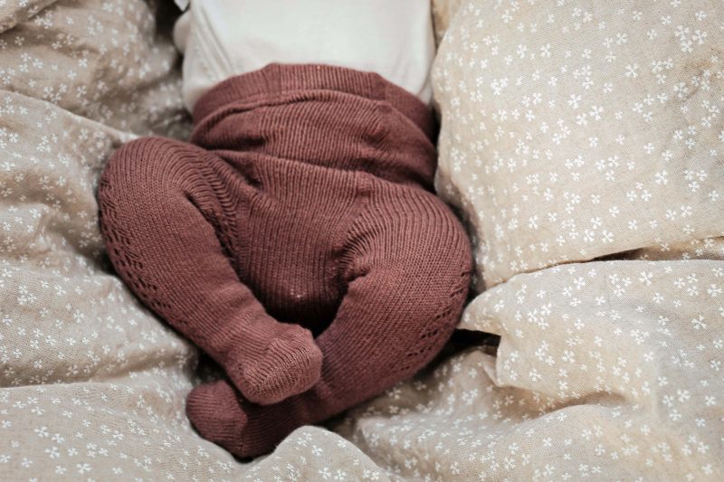 Baby in linen bedding